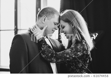 Elegant couple touching face to face, with closed Elegant couple touching face to face, with closed 61074458