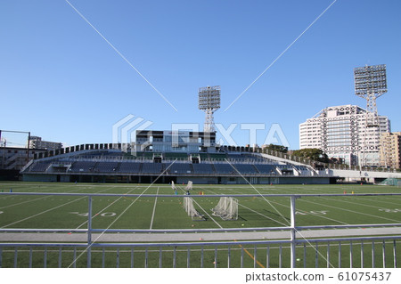 I went to watch a soccer match of a sunny day 61075437