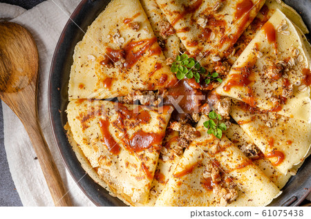 Caramel crepes with granola 61075438