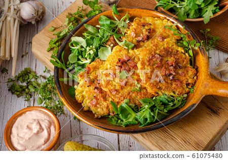 Potato pancakes, delish salad 61075480