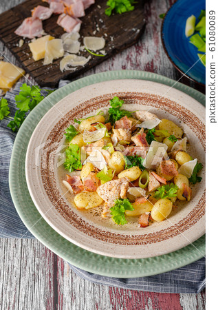 Homemade gnocchi with parmesan chicken 61080089