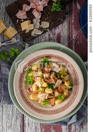 Homemade gnocchi with parmesan chicken Homemade gnocchi with parmesan chicken 61080093