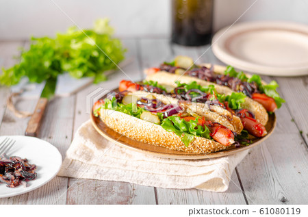 Hot dog with red onion Hot dog with red onion 61080119