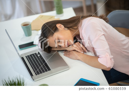 Top view of a young sleeping woman Top view of a young sleeping woman 61080339