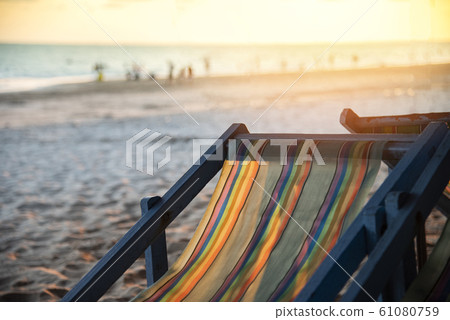 Chair beach with sunset on summer sandy beach sea 61080759