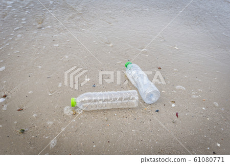 Garbage in the sea with plastic bottle on beach Garbage in the sea with plastic bottle on beach 61080771