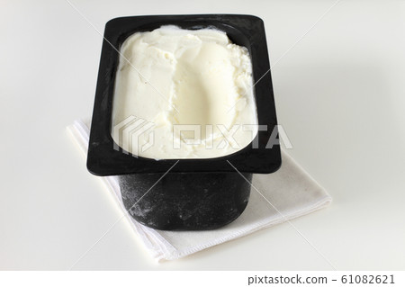 ice cream in a tray container on white background 61082621