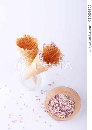 empty ice cream cones with colorful sprinkles empty ice cream cones with colorful sprinkles 61084392