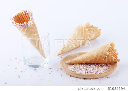 empty ice cream cones with colorful sprinkles empty ice cream cones with colorful sprinkles 61084394