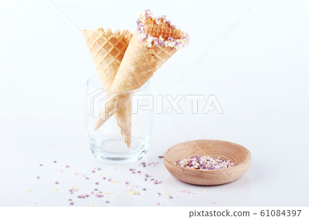 empty ice cream cones with colorful sprinkles empty ice cream cones with colorful sprinkles 61084397