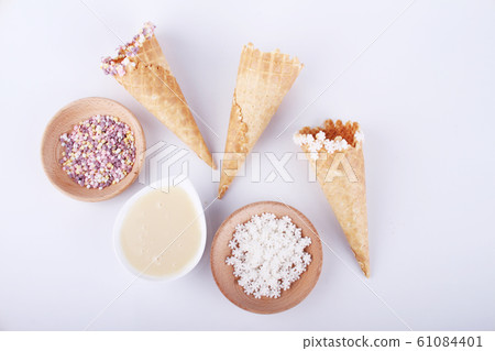 empty ice cream cones with colorful sprinkles empty ice cream cones with colorful sprinkles 61084401