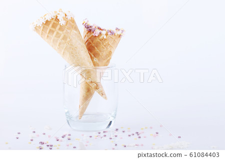 empty ice cream cones with colorful sprinkles empty ice cream cones with colorful sprinkles 61084403