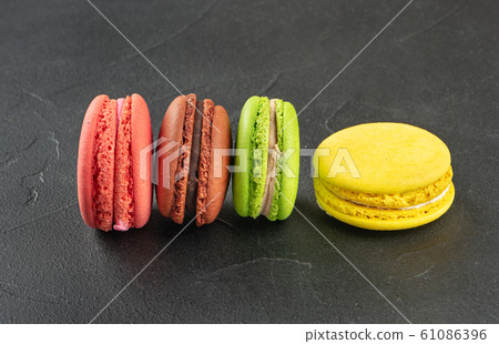 Four multicolored macaroons Four multicolored macaroons 61086396
