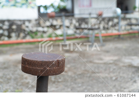 Diy metal iron dumbbell on a outdoor fitness gym floor Diy metal iron dumbbell on a outdoor fitness gym floor 61087144