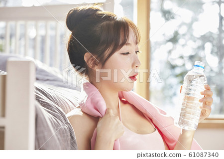 Young woman, exercise, health, diet, sport, relax, rest, water, bottle, bedroom, room, house Young woman, exercise, health, diet, sport, relax, rest, water, bottle, bedroom, room, house 61087340