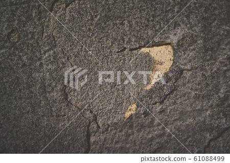 Background texture of asphalt. Hard old painted wall in grunge style. Grey surface for design and text. Close up view Background texture of asphalt. Hard old painted wall in grunge style. Grey surface for design and text. Close up view 61088499