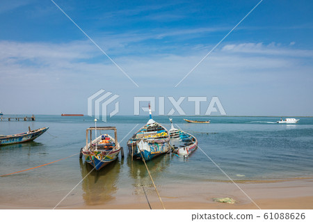 Traditional painted wooden fishing boat in Djiffer, Senegal. West Africa. 61088626