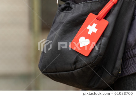 Person carrying a help card Help mark Person carrying a help card Help mark 61088700