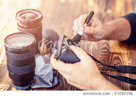 Preparing and cleaning set of photography equipments for shoting pictures 61089398