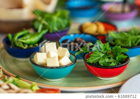 Preperation of a rich mediterranean breakfast for a healthy life Preperation of a rich mediterranean breakfast for a healthy life 61089712