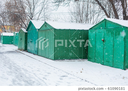Metal garages in the CIS countries in the winter. Metal garages in the CIS countries in the winter. 61090181