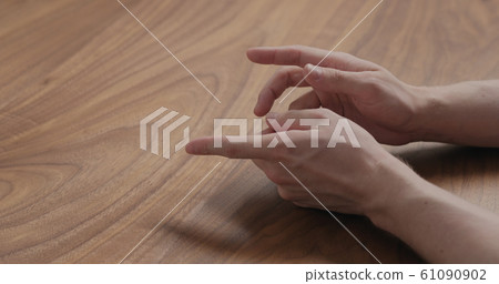 man hand suggestions gesture on black walnut table man hand suggestions gesture on black walnut table 61090902