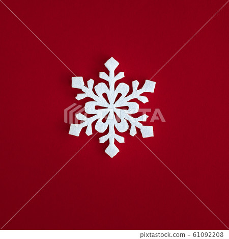 Christmas holidays composition, top view white snowflakes decoration on red background with copy 61092208