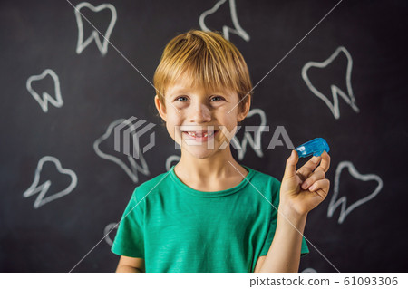 Six-year old boy shows myofunctional trainer. Helps equalize the growing teeth and correct bite Six-year old boy shows myofunctional trainer. Helps equalize the growing teeth and correct bite 61093306