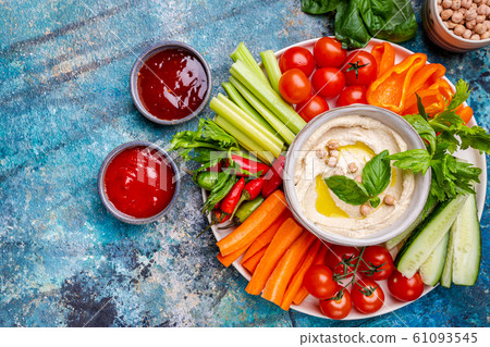 Hummus platter with assorted snacks. Hummus platter with assorted snacks. 61093545