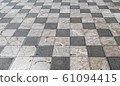Wide checkered floor with black and white tiles 61094415