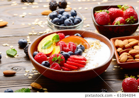 Fruit healthy muesli with peaches strawberry Fruit healthy muesli with peaches strawberry 61094894