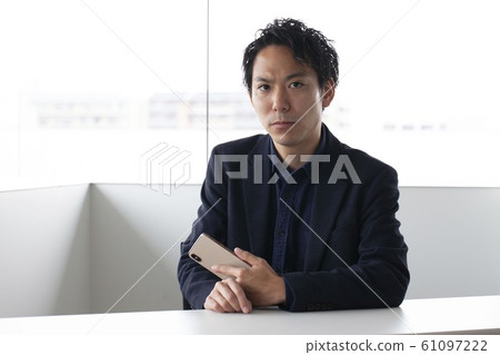 Men with smartphones Men with smartphones 61097222