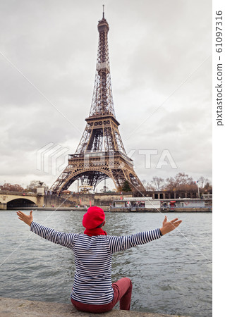 Man sits on the Bank of a river Man sits on the Bank of a river 61097316