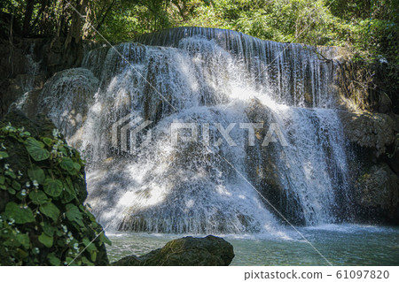 The clean waterfall there is an emerald green 61097820
