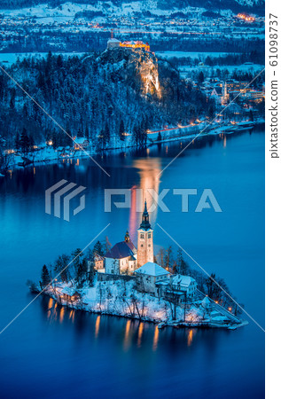 Twilight view of Lake Bled with Bled Island and Castle in winter, Slovenia Twilight view of Lake Bled with Bled Island and Castle in winter, Slovenia 61098737