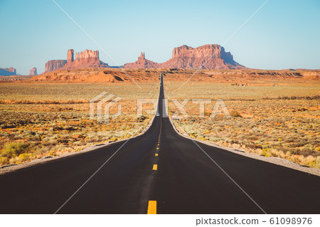 Classic highway view in Monument Valley at sunset, USA 61098976