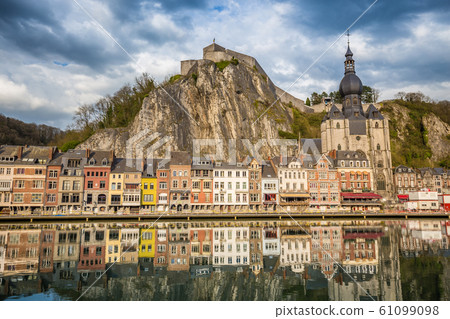 Historic town of Dinant with river Meuse at sunset, Wallonia, Belgium Historic town of Dinant with river Meuse at sunset, Wallonia, Belgium 61099098