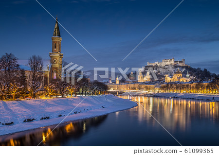 Hstoric city of Salzburg in winter at dusk, Austria 61099365