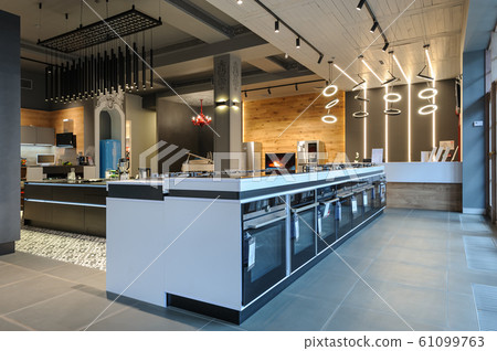 Brand new ovens and gas stoves in apliance store showroom 61099763