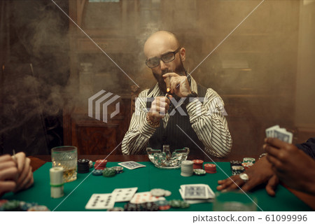 Bearded poker player with cigar, casino 61099996
