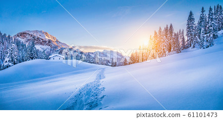 Winter wonderland in the Alps with mountain hut at sunset Winter wonderland in the Alps with mountain hut at sunset 61101473