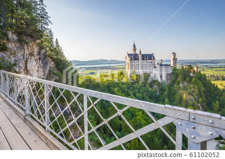 Neuschwanstein Castle with Marienbrucke bridge at sunset, Bavaria, Germany 61102052