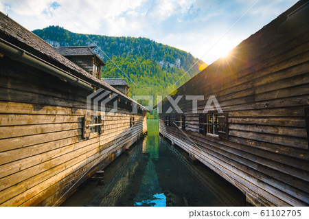 Wooden boathouses at Lake Konigssee at sunset, Bavaria, Germany Wooden boathouses at Lake Konigssee at sunset, Bavaria, Germany 61102705