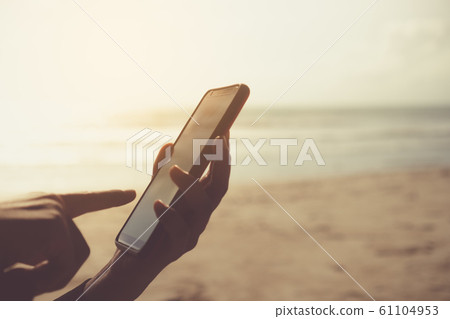 Woman hand using smartphone or tablet to do Woman hand using smartphone or tablet to do 61104953
