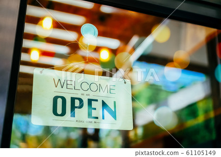A business sign that says open on cafe or 61105149