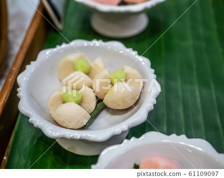 Thai style dessert, made from flour and coconut, on ceramic tray 61109097
