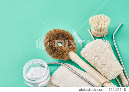 Set of eco friendly items on a green background. Set of eco friendly items on a green background. 61110548