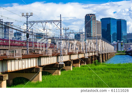 Osaka Yodogawa riverbed, Hankyu train and Umeda building scenery 61111026