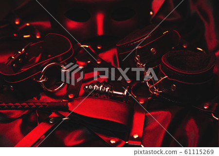 metal anal plug, leather handcuffs, whip, belt, choker and mask for role-playing erotic games. Set of toys for BDSM sex 61115269