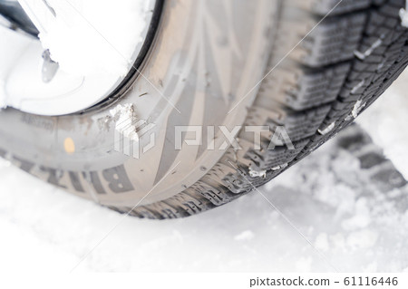 Snowy road and tires 61116446